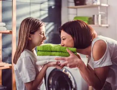Handing Laundry Shutterstock 1061755562 Resized